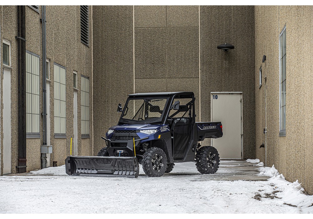 Kolpin Conqueror plow mounted on a UTV in the snow